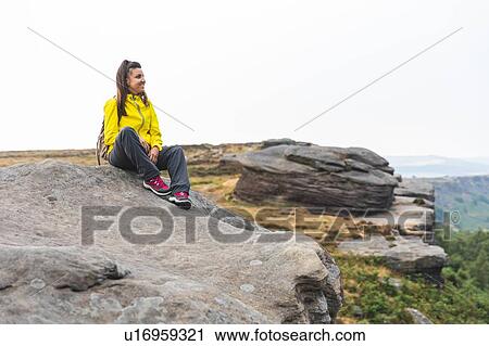 Stock Image - Hiker relaxed and happy, Chrome Hill, Peak District, Derbyshire. Fotosearch