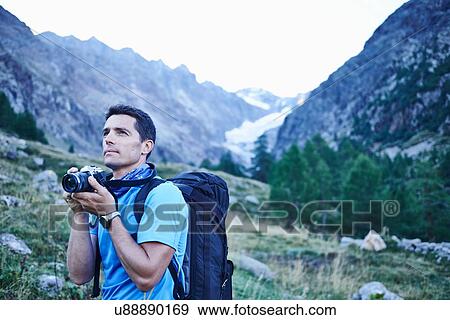 Hiker taking photograph, Mont Cervin, Matterhorn, Valais, Switzerland View Large Photo Image Stock Photo - Hiker taking photograph, Mont Cervin, Matterhorn, Valais, Switzerland. Fotosearch