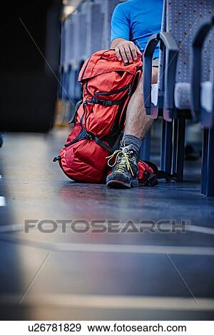Hiker with rucksack in train View Large Photo Image Stock Photo - Hiker with rucksack in train. Fotosearch