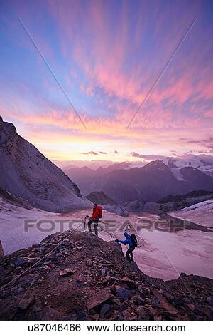 Hikers climbing rock at sunset, Mont Cervin, Matterhorn, Valais, Switzerland View Large Photo Image Stock Photograph - Hikers climbing rock at sunset, Mont Cervin, Matterhorn, Valais, Switzerland. Fotosearch