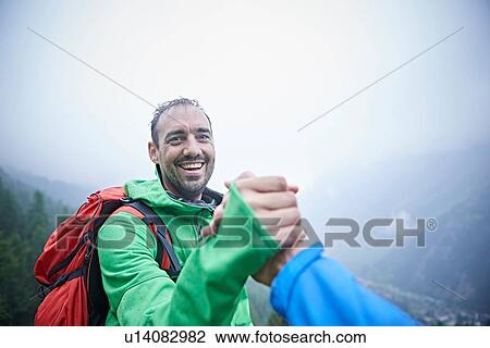 Hikers congratulating themselves, Mont Cervin, Matterhorn, Valais, Switzerland View Large Photo Image Stock Image - Hikers congratulating themselves, Mont Cervin, Matterhorn, Valais, Switzerland. Fotosearch