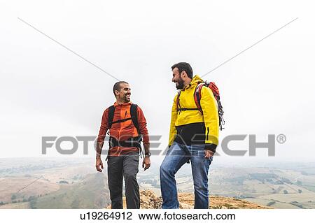Hikers enjoying conversation, Chrome Hill, Peak District, Derbyshire View Large Photo Image Stock Image - Hikers enjoying conversation, Chrome Hill, Peak District, Derbyshire. Fotosearch