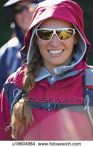 Hikers in hooded jacket and sunglasses View Large Photo Image Picture - Hikers in hooded jacket and sunglasses. Fotosearch