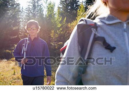 Hikers on sunny day's trek View Large Photo Image Stock Image - Hikers on sunny day's trek. Fotosearch