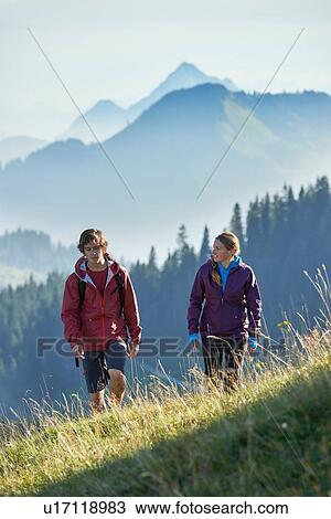 Hikers trekking on hillside, Manigod, Rhone-Alpes, France View Large Photo Image Stock Image - Hikers trekking on hillside, Manigod, Rhone-Alpes, France. Fotosearch