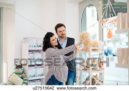 Husband and pregnant wife shopping for soft toys View Large Photo Image Stock Image - Husband and pregnant wife shopping for soft toys. Fotosearch