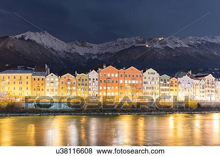 Illuminated houses along Inn River, Innsbruck, Tirol, Austria View Large Photo Image Stock Photo - Illuminated houses along Inn River, Innsbruck, Tirol, Austria. Fotosearch