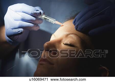 Stock Image - Injecting botox. Fotosearch