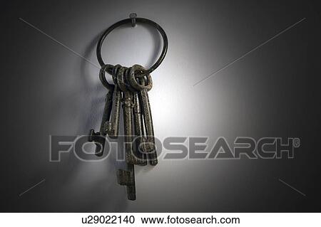 Stock Image - Keys against grey background. Fotosearch