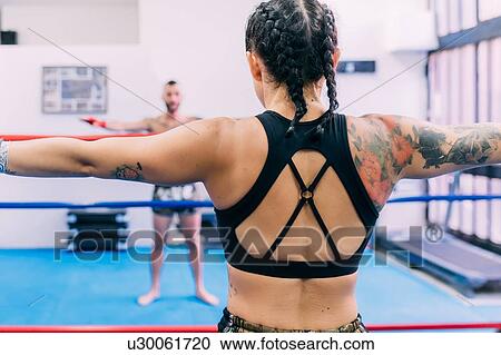 Male and female boxers working out in boxing ring View Large Photo Image Stock Image - Male and female boxers working out in boxing ring. Fotosearch
