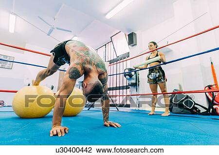 Male and female boxers working out in boxing ring View Large Photo Image Stock Image - Male and female boxers working out in boxing ring. Fotosearch