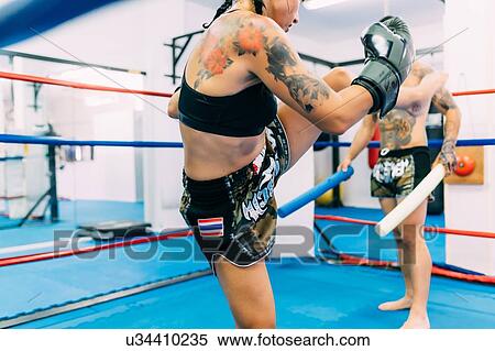 Male and female boxers working out in boxing ring View Large Photo Image Stock Photography - Male and female boxers working out in boxing ring. Fotosearch