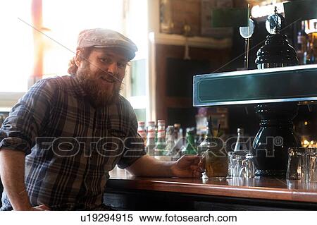 Male customers at bar in traditional Irish public house, portrait View Large Photo Image Stock Photography - Male customers at bar in traditional Irish public house, portrait. Fotosearch
