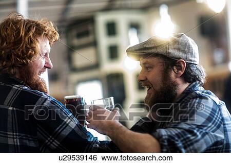 Male customers laughing in traditional Irish public house View Large Photo Image Stock Photograph - Male customers laughing in traditional Irish public house. Fotosearch