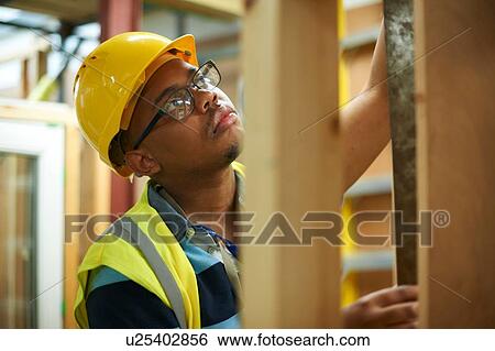 Male higher education student building wooden framework in college workshop View Large Photo Image Stock Photograph - Male higher education student building wooden framework in college workshop. Fotosearch