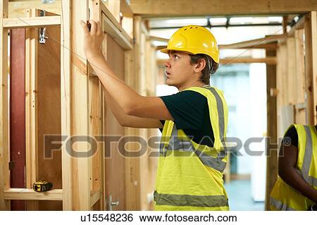 Male higher education students building wooden framework in college workshop View Large Photo Image Stock Photograph - Male higher education students building wooden framework in college workshop. Fotosearch