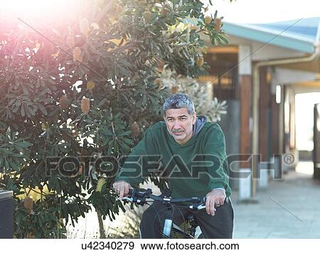 Stock Photo - Man on bicycle enjoying, Melbourne, Victoria, Australia. Fotosearch