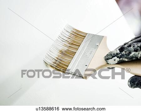 Man painting wall white View Large Photo Image Stock Photograph - Man painting wall white. Fotosearch