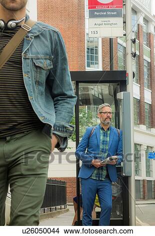 Man waiting at bus stop, London, UK View Large Photo Image Picture - Man waiting at bus stop, London, UK. Fotosearch