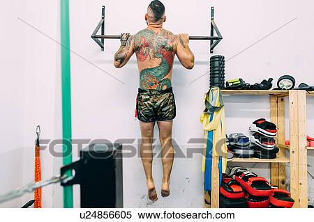 Man working out on metal bars View Large Photo Image Stock Photography - Man working out on metal bars. Fotosearch