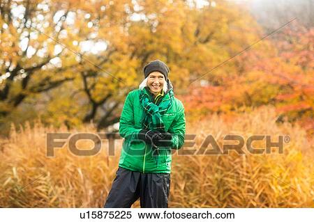 Mature woman exercising in park View Large Photo Image Stock Photography - Mature woman exercising in park. Fotosearch