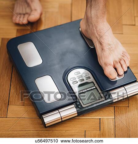 Measuring body weight View Large Photo Image Stock Image - Measuring body weight. Fotosearch