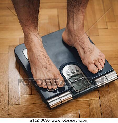 Measuring body weight View Large Photo Image Stock Photograph - Measuring body weight. Fotosearch