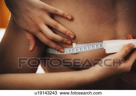 Stock Image - Measuring chest circumference. Fotosearch