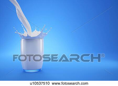 Stock Image - Milk pouring into a glass full of milk with crown splash. On blue background. With free space on a side to add text.. Fotosearch