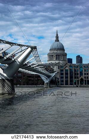 Stock Image - Millennium Bridge over River Thames, St Paul's Cathedral in background, London, England, UK. Fotosearch