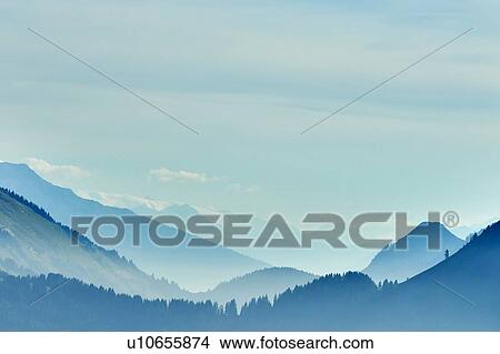 Mist over mountain ranges, Manigod, Rhone-Alpes, France View Large Photo Image Picture - Mist over mountain ranges, Manigod, Rhone-Alpes, France. Fotosearch