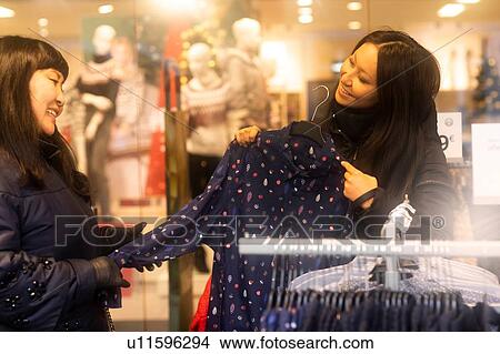 Mother and daughter window shopping at Christmas market, Freiburg, Baden-Wurttemberg, Germany View Large Photo Image Picture - Mother and daughter window shopping at Christmas market, Freiburg, Baden-Wurttemberg, Germany. Fotosearch