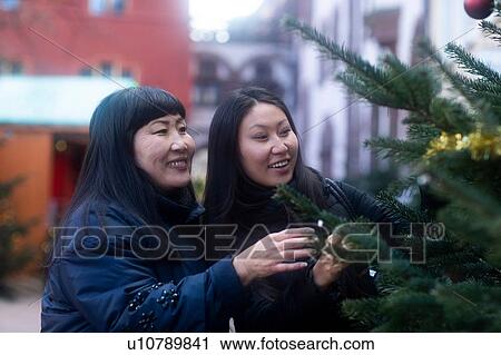 Mother and daughter window shopping at Christmas market, Freiburg, Baden-Wurttemberg, Germany View Large Photo Image Stock Image - Mother and daughter window shopping at Christmas market, Freiburg, Baden-Wurttemberg, Germany. Fotosearch