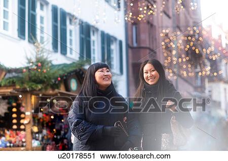 Mother and daughter window shopping at Christmas market, Freiburg, Baden-Wurttemberg, Germany View Large Photo Image Stock Image - Mother and daughter window shopping at Christmas market, Freiburg, Baden-Wurttemberg, Germany. Fotosearch