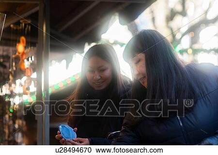Mother and daughter window shopping at Christmas market, Freiburg, Baden-Wurttemberg, Germany View Large Photo Image Stock Image - Mother and daughter window shopping at Christmas market, Freiburg, Baden-Wurttemberg, Germany. Fotosearch