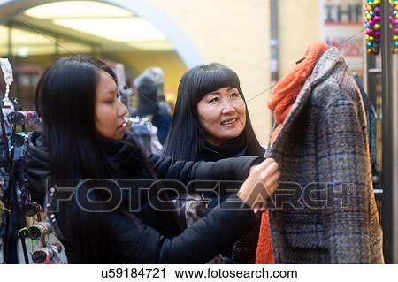 Mother and daughter window shopping at Christmas market, Freiburg, Baden-Wurttemberg, Germany View Large Photo Image Stock Image - Mother and daughter window shopping at Christmas market, Freiburg, Baden-Wurttemberg, Germany. Fotosearch