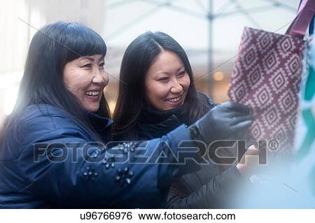 Mother and daughter window shopping at Christmas market, Freiburg, Baden-Wurttemberg, Germany View Large Photo Image Stock Photograph - Mother and daughter window shopping at Christmas market, Freiburg, Baden-Wurttemberg, Germany. Fotosearch