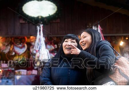 Mother and daughter window shopping at Christmas market, Freiburg, Baden-Wurttemberg, Germany View Large Photo Image Stock Photography - Mother and daughter window shopping at Christmas market, Freiburg, Baden-Wurttemberg, Germany. Fotosearch