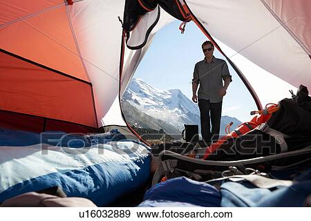Stock Photo - Mountain climber camping, Chamonix, Rhone-Alps, France. Fotosearch