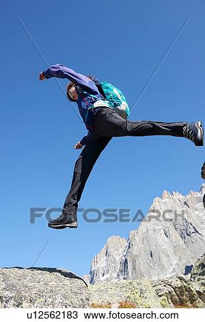 Mountain climber jumping, Chamonix, Rhone-Alps, France View Large Photo Image Stock Image - Mountain climber jumping, Chamonix, Rhone-Alps, France. Fotosearch