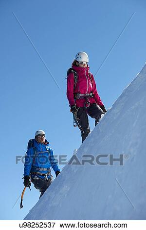Stock Photo - Mountain climber on snowy slope, Chamonix, Rhone-Alps, France. Fotosearch