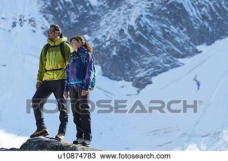 Mountain climbers enjoying view, Chamonix, Rhone-Alps, France View Large Photo Image Stock Image - Mountain climbers enjoying view, Chamonix, Rhone-Alps, France. Fotosearch