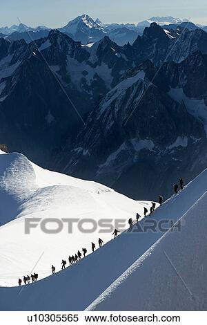 Mountain climbers on descent in distance, Chamonix, Rhone-Alps, France View Large Photo Image Stock Photography - Mountain climbers on descent in distance, Chamonix, Rhone-Alps, France. Fotosearch