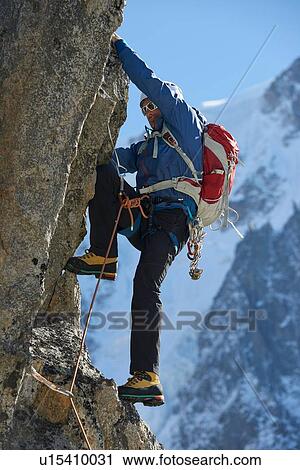 Mountaineer using harness for climb, Chamonix, Rhone-Alps, France View Large Photo Image Stock Image - Mountaineer using harness for climb, Chamonix, Rhone-Alps, France. Fotosearch