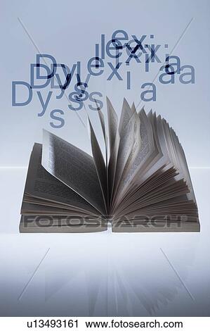 Stock Image - Open book and dyslexia, conceptual image. Dyslexia is a learning disorder that manifests itself as a difficulty with reading and spelling.. Fotosearch