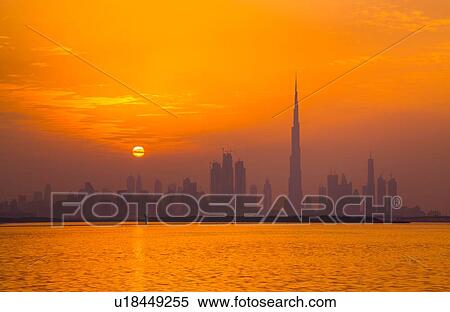 Orange glow of sky reflected in sea, Dubai, UAE View Large Photo Image Stock Photography - Orange glow of sky reflected in sea, Dubai, UAE. Fotosearch