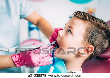 Orthodontist working with little boy. View Large Photo Image Stock Photo - Orthodontist working with little boy.. Fotosearch