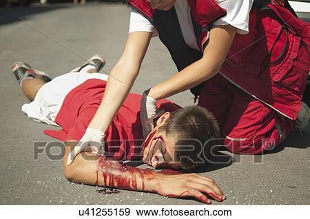Paramedic with car accident victim View Large Photo Image Stock Photo - Paramedic with car accident victim. Fotosearch