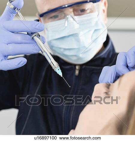 Patient receiving dental anaesthetic View Large Photo Image Stock Image - Patient receiving dental anaesthetic. Fotosearch