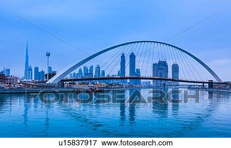 Pedestrian bridge across Dubai Creek, Water Canal Walk, UAE View Large Photo Image Stock Photo - Pedestrian bridge across Dubai Creek, Water Canal Walk, UAE. Fotosearch